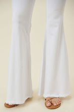 Load image into Gallery viewer, Make a fashion statement in our Vibrant M.i.U High Waisted Flare White Jeans. This jean comes in an extreme flare fit featuring two back patch pockets, faux front pockets, light frayed bottom hem, and a zip-fly closure. Style these jeans with a statement top and a high heel for a look that will have everyone talking.
