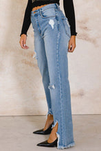 Load image into Gallery viewer, With a high waist and a light wash, these Something New High Rise Distressed Hem Wide Leg Jeans are ideal for dressing up or down. The subtle distressing at the raw hem makes them perfect for taking your style from day to night, while the flared cuffs give a bold look that you won&#39;t want to take off.
