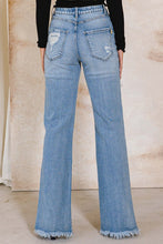 Load image into Gallery viewer, With a high waist and a light wash, these Something New High Rise Distressed Hem Wide Leg Jeans are ideal for dressing up or down. The subtle distressing at the raw hem makes them perfect for taking your style from day to night, while the flared cuffs give a bold look that you won&#39;t want to take off.
