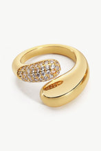 Load image into Gallery viewer, A simplistic yet elegant ring with a geometric style featuring a bypass design fashioned from polished stainless steel and crystals.
