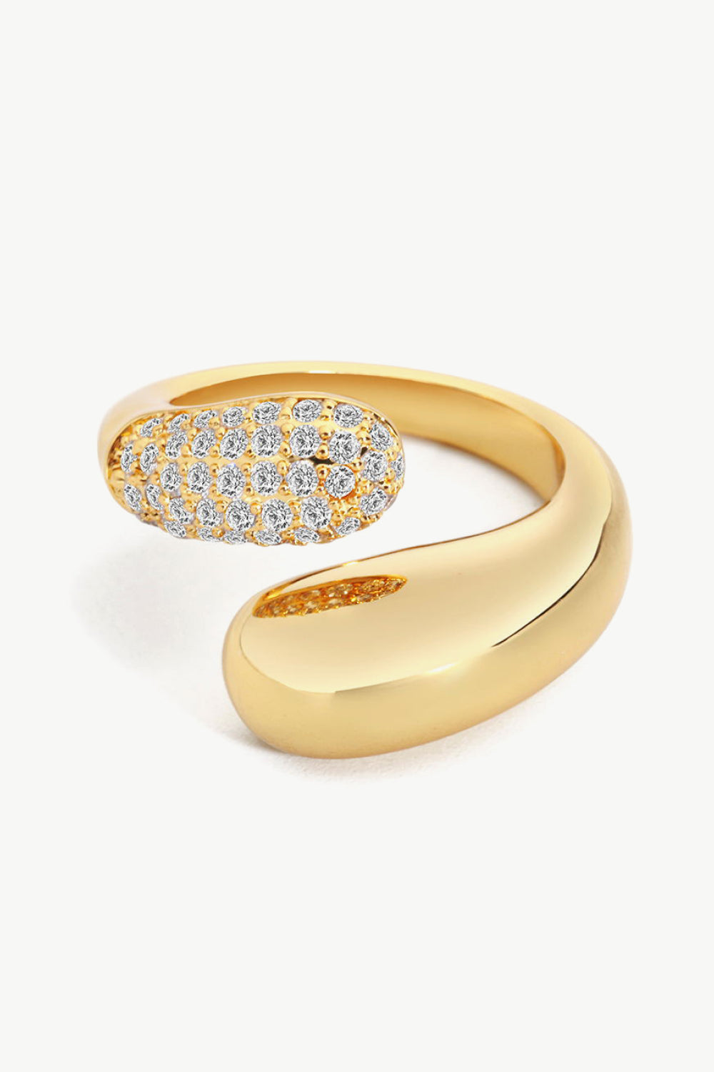 A simplistic yet elegant ring with a geometric style featuring a bypass design fashioned from polished stainless steel and crystals.