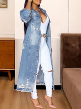 Load image into Gallery viewer, Take your outfit of the day to a whole new level, be sure to gain all the style credentials, regardless of your agenda. Crafted from a light blue denim fabric, with a button-down silhouette and a relaxed fit, this distressed jacket will be sure to captivate all the attention. Elevate your look with this jacket, teamed with a denim skirt, clear heels, and gold hoop earrings - a combination that we simply adore.
