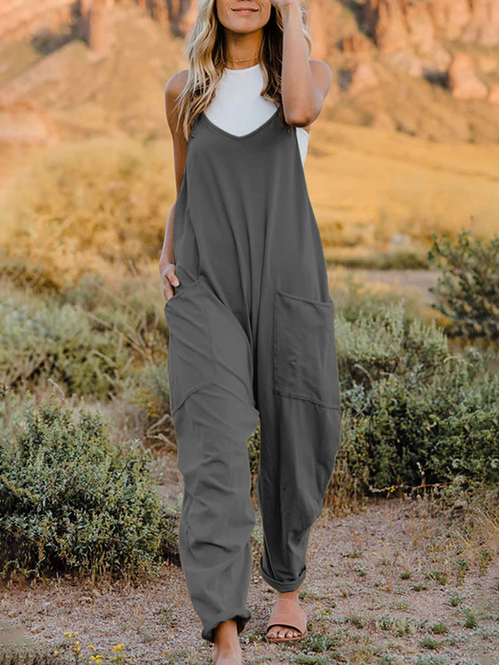 This Sunrise jumpsuit features a striking V- neckline, pockets and lots of stretch for added comfort, this full-size sleeveless jumpsuit comes in a variety of colors. Our Sunrise jumpsuit is stylish, comfortable and its lightweight fabric makes it ideal for summer or fall events, such as brunch or a family BBQ. Style with a bag and your favorite sandals for a complete look.