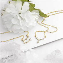 Load image into Gallery viewer, Keep your lucky stars with you at all times with the Pisces Astrology Constellation Necklace. A unique and cute dainty necklace you can wear to any occasion. Carry your love for astrology and connection to your birth sign everywhere you go with this zodiac necklace.
