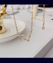 Load image into Gallery viewer, Keep your lucky stars with you at all times with the Aries Astrology Constellation Necklace. A unique and cute dainty necklace you can wear to any occasion. Carry your love for astrology and connection to your birth sign everywhere you go with this zodiac necklace.
