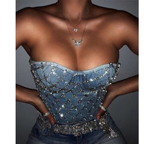 Load image into Gallery viewer, Do the most in this trendy blue jean crystal denim bustier crop top! This destructed beautiful rhinestone-embellished denim bustier bra features a rhinestone detailed pattern, sweetheart neckline, adjustable, detachable shoulder straps, a row of hidden hook back closures, and built-in padded bra.
