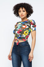 Load image into Gallery viewer, This cute and casual top can be dressed up or down depending on your mood. Complete the look by pairing the alpha camo crop top with jeans, a denim jacket, and white sneakers.
