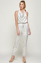 Load image into Gallery viewer, We&#39;re loving this jumpsuit the perfect &#39;gram-worthy fit. Whether you&#39;re looking to create a casual look or dress it up for a more work-friendly look, this piece has got you covered! This jumpsuit features soft satin material, halter, pockets, and elastic waistband drawstring. Pair this piece with a transparent high heel, gold accessories, and a handbag for an outfit you will love! 
