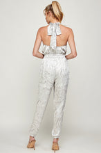 Load image into Gallery viewer, We&#39;re loving this jumpsuit the perfect &#39;gram-worthy fit. Whether you&#39;re looking to create a casual look or dress it up for a more work-friendly look, this piece has got you covered! This jumpsuit features soft satin material, halter, pockets, and elastic waistband drawstring. Pair this piece with a transparent high heel, gold accessories, and a handbag for an outfit you will love! 
