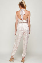 Load image into Gallery viewer, We&#39;re loving this jumpsuit the perfect &#39;gram-worthy fit. Whether you&#39;re looking to create a casual look or dress it up for a more work-friendly look, this piece has got you covered! This jumpsuit features soft satin material, halter, pockets, and elastic waistband drawstring. Pair this piece with a transparent high heel, gold accessories, and a handbag for an outfit you will love! 
