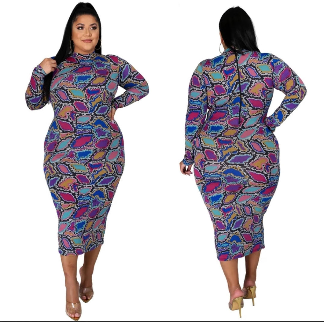 Slip into this super sexy dress for your next night out with the girls or date night! This dress hugs your body in all the right places. This sexy snake print long bodycon dress is versatile you can wear the zipper in the front or back. Style this dress with a black high heel and clutch for a complete look. 