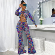 Load image into Gallery viewer, Colorful Jungle Jumpsuit - Multi Color Get ready to flaunt your flawless summer body in this colorful sexy jumpsuit! The lace up detail and front cut out will give you a flattering silhouette and ultra sexy look. Wear this snake skin jumpsuit with your favorite heels, golden hoops and handbag for an edgy glam look. 
