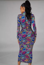 Load image into Gallery viewer, Slip into this super sexy dress for your next night out with the girls or date night! This dress hugs your body in all the right places. This sexy snake print long bodycon dress is versatile you can wear the zipper in the front or back. Style this dress with a black high heel and clutch for a complete look. 
