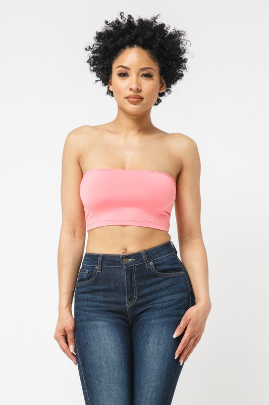 This tube top is everything that you need switch up your wardrobe with our Sweet As Candy Tube Top. Featuring a vibrant coral soft cotton blend material with a bandeau neckline and a cropped length, we are obsessed. Wear this with high waist pants and high heels or sandals for the ultimate cute or casual look that you will absolutely love.