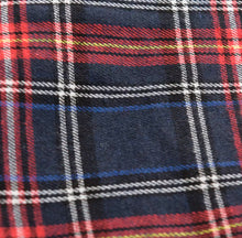 Load image into Gallery viewer, Our Don&#39;t Talk Back Plaid Skirt flattering retro-inspired and luxurious statement piece that you&#39;ll turn to again and again. Featuring an asymmetrical design, a belt, two front pockets and elastic waistband; you need this in your closet! Pair with a stylish crop top, high heel and statement bag for a complete look. 
