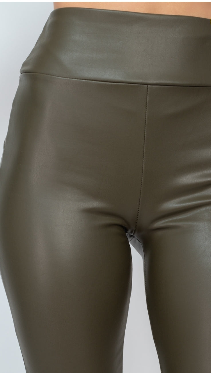 Obsessed is an understatement when it comes to these Faux leather leggings. This is surely a piece for your closet! Material that allows great stretch this pant sculpts your body in all the right places. These trendy pants are skinny fit and elasticized waistband. Pair with a statement knitted top and high heels to give your look an edgy but stylish finish to complete your look. 