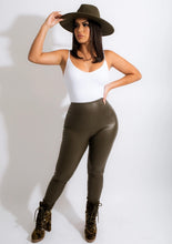 Load image into Gallery viewer, Obsessed is an understatement when it comes to these Faux leather leggings. This is surely a piece for your closet! Material that allows great stretch this pant sculpts your body in all the right places. These trendy pants are skinny fit and elasticized waistband. Pair with a statement knitted top and high heels to give your look an edgy but stylish finish to complete your look. 

