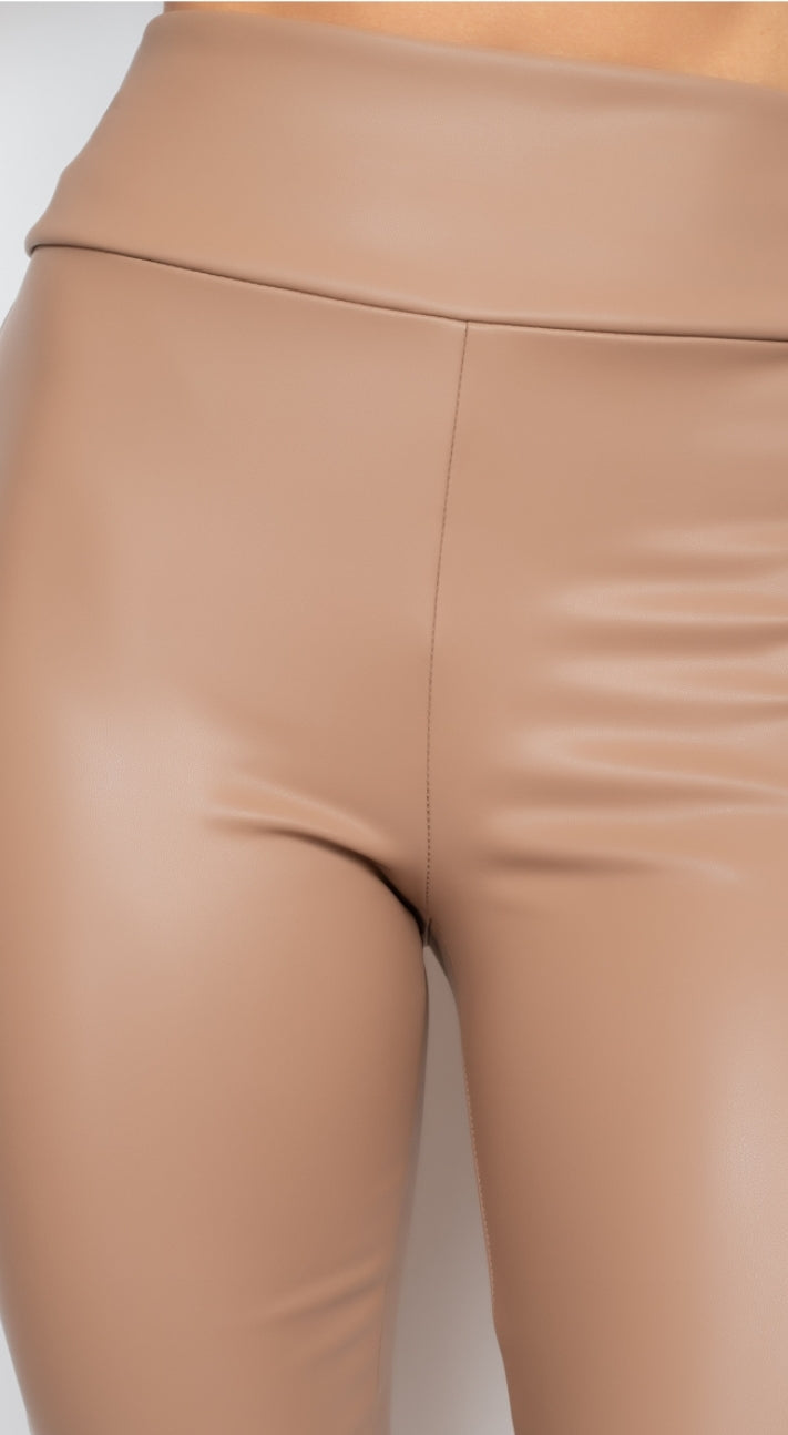 Obsessed is an understatement when it comes to these Faux leather leggings. This is surely a piece for your closet! Material that allows great stretch this pant sculpts your body in all the right places. These trendy pants are skinny fit and elasticized waistband. Pair with a statement knitted top and high heels to give your look an edgy but stylish finish to complete your look. 