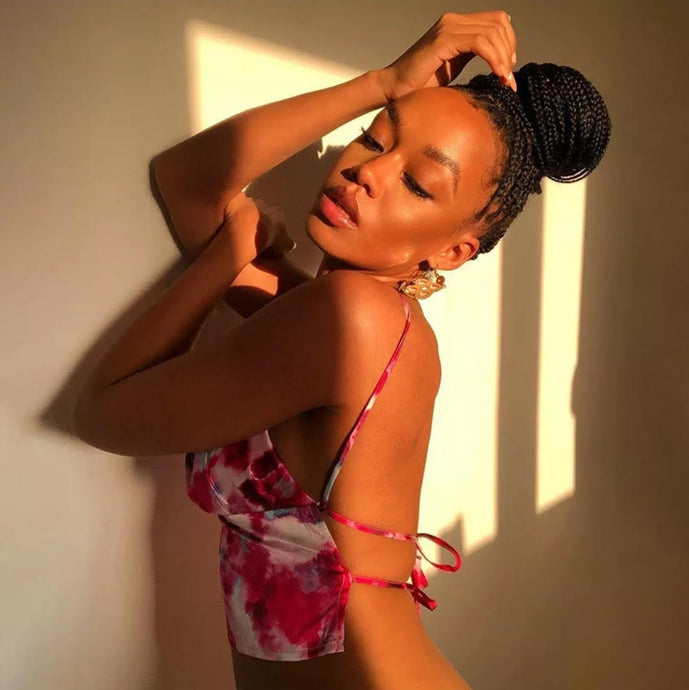 This satin tie die festival top is sure to take your weekend look that extra mile. Featuring a pink, white and baby blue material with a backless design and thin strap detailing, cowl neckline and a cropped length. Style with blue jeans and high heels for a date night with the bae.