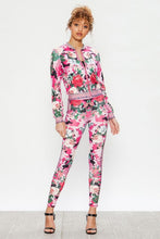 Load image into Gallery viewer, We&#39;re bringing you the ultimate Flowers and Camo tracksuit! Perfect for building your favorite looks all year round. This tracksuit is luxurious, has excellent stretch, and extremely comfortable. The jacket is long sleeve, soft stretch fit, with a front zipper. The bottoms are stretchy waistband and hugs you in all the right places. Pair with transparent heels, gold jewelry to create a cute and casual look. 
