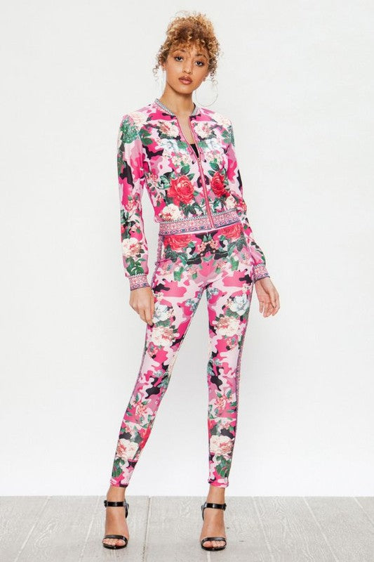 We're bringing you the ultimate Flowers and Camo tracksuit! Perfect for building your favorite looks all year round. This tracksuit is luxurious, has excellent stretch, and extremely comfortable. The jacket is long sleeve, soft stretch fit, with a front zipper. The bottoms are stretchy waistband and hugs you in all the right places. Pair with transparent heels, gold jewelry to create a cute and casual look. 