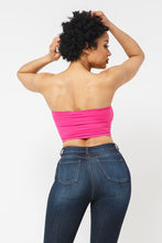 Load image into Gallery viewer, This tube top is everything that you need switch up your wardrobe with our Sweet As Candy Tube Top. Featuring a vibrant fuchsia soft cotton blend material with a bandeau neckline and a cropped length, we are obsessed. Wear this with high waist pants and high heels or sandals for the ultimate cute or casual look that you will absolutely love.
