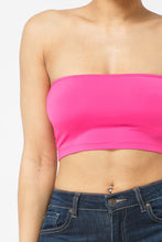 Load image into Gallery viewer, This tube top is everything that you need switch up your wardrobe with our Sweet As Candy Tube Top. Featuring a vibrant fuchsia soft cotton blend material with a bandeau neckline and a cropped length, we are obsessed. Wear this with high waist pants and high heels or sandals for the ultimate cute or casual look that you will absolutely love.
