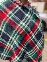 Load image into Gallery viewer, Drape yourself in style and warmth with our pretty Giving You Everything poncho featuring warm material plaid patterned with a roomy hood, open sides, and an ultra-draped silhouette that falls into an uneven knee-length hemline with fringe trim detailing!
