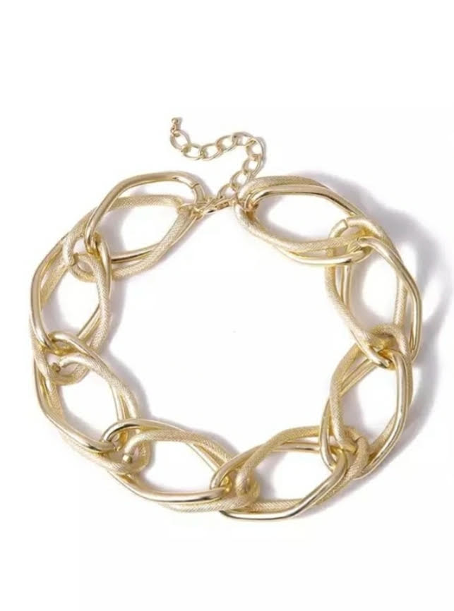 Golden Chain Choker Necklace   Make a bold accessory statement with this thick gold chain necklace. This necklace featuring a thick chain detail and clasp closure. Dress it up or down, our jewelry collection is filled with pieces that add instant polish.