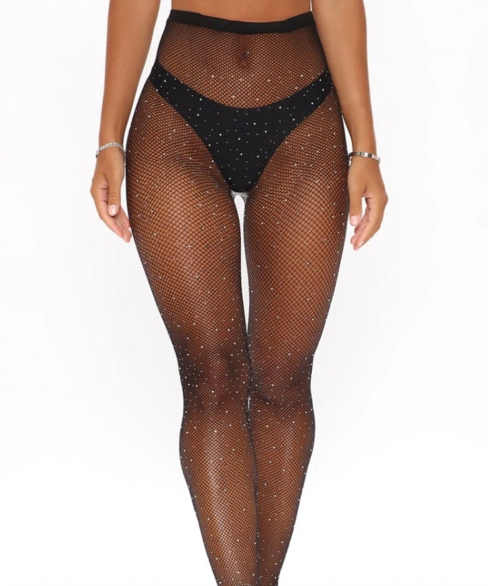 Shine on with our sexy rhinestone tights. This glamorous stocking features a classic fishnet style design with sparkling holographic all over rhinestone embellishments with a comfortable waistband that provides both flexibility and versatility with smooth micro net to blend.