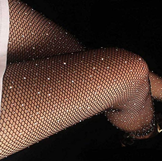 Shine on with our sexy rhinestone tights. This glamorous stocking features a classic fishnet style design with sparkling holographic all over rhinestone embellishments with a comfortable waistband that provides both flexibility and versatility with smooth micro net to blend.