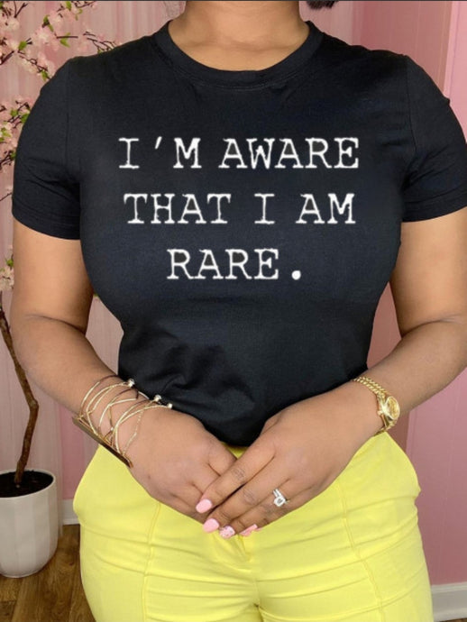 This is a must in your wardrobe! Our I'm Aware That I'm Rare Top has plenty of confidence and is a statement piece. Has a crew neck, short sleeves, loose fitting and soft fabric. Style it with your favorite jeans and high heels for an elevated casual look.