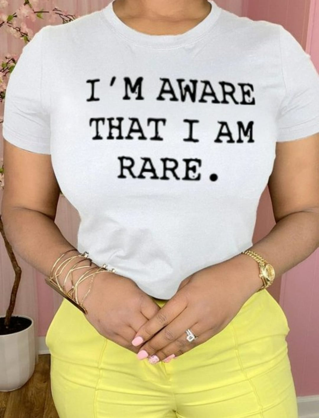 This is a must in your wardrobe! Our I'm Aware That I'm Rare Top has plenty of confidence and is a statement piece. Has a crew neck, short sleeves, loose fitting and soft fabric. Style it with your favorite jeans and high heels for an elevated casual look.