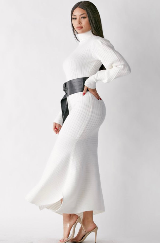 Keep cozy in this effortless cashmere turtleneck sweater dress this season. This white turtleneck sweater dress should be in every closet. Featuring a soft ribbed knitted fabric, turtle neck, puff sleeves and a faux leather waist belt. Team this with sexy boots and simple accessories to complete the look. 
