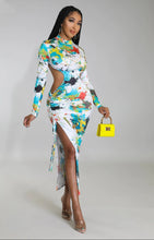 Load image into Gallery viewer, We&#39;re loving this super cute and sexy dress babe! Perfect for your birthday, a romantic date, or a night out with your girls. Features include print sheer material, ruched detailing and a sexy slit. Pair with a simple high heel and a mini handbag for a fun and flirty look.
