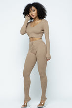 Load image into Gallery viewer, This Just Chill Set is every wardrobe essential. Featuring a nude rib kitted fabric with a V neckline top with long sleeves, high rise pants with soft elasticized waistband, lightweight material. Style with a high heel or boots and handbag for a weekend look you&#39;ll love! 
