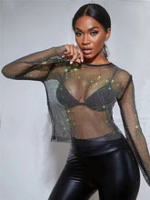 Load image into Gallery viewer, Can you feel the love tonight in this season with this flirty  top is made from a rhinestone netting fabrication, long sleeve and is complete with a crew neckline. This top will make any outfit special. Style this mesh rhinestone crop over your favorite bralette top and a pair of high waisted leather pants for a sexy glam date night look!
