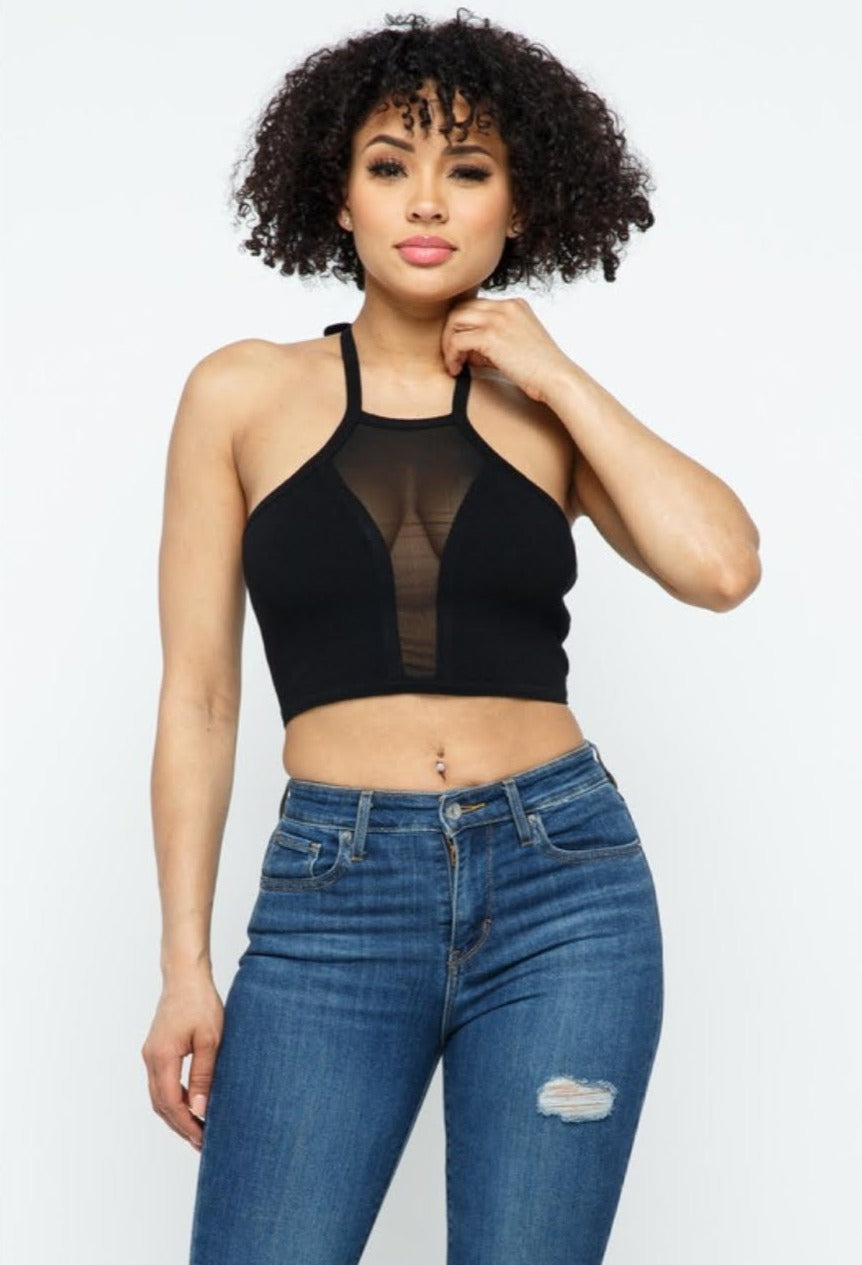 This To Cute To Be Basic crop top is calling your name this season! Featuring a soft material, a halter neck fit, and mesh v-neckline; it's perfect for so many summer activities! Style with your favorite pair of denim jeans, silver accessories and high heels for a trendy outfit of the day or night!