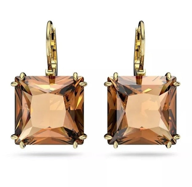 A celebration of femininity and modern design, these Swarovski earrings Bold yet refined, these pierced earrings are a timeless everyday choice. Featuring square cut crystals in a warm orange hue, this pair is finished with a classic, gold tone plated setting. Style yours with denim or sharp tailoring with this versatile design, anything goes.