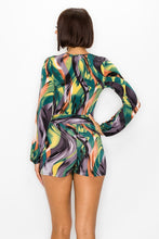 Load image into Gallery viewer, Elevate your wardrobe with this bold sexy romper. Featuring a trendy swirl print with adjustable belt, we are obsessed. Pair with heels and accessories for a look that is sure to make a statement this season.
