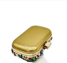 Load image into Gallery viewer, Become the ultimate trendsetter when pairing your outfits with our pretty Nubian multi color beaded clutch purse. Ideal for babe&#39;s who love a colorful wardrobe. Featuring a turquoise jewels, colorful beaded detailing, and with a hasp snap closure. This purse pairs perfectly with a any dress and some sexy high heels and some accessories to complete the look.
