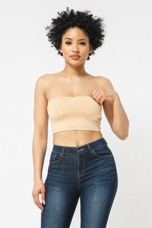 This tube top is everything that you need switch up your wardrobe with our Sweet As Candy Tube Top. Featuring a nude soft cotton blend material with a bandeau neckline and a cropped length, we are obsessed. Wear this with high waist pants and high heels or sandals for the ultimate cute or casual look that you will absolutely love.