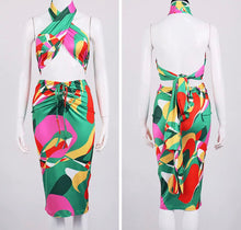 Load image into Gallery viewer, This sexy Picasso skirt set is everything and a definite must have for your wardrobe babe. Easy to style and has plenty stretch! This super cute skirt set comes in a mid length featuring a ruched detail, elastic waistband and matching cross wrap top. Pair with a statement high heels and handbag for a complete look. 
