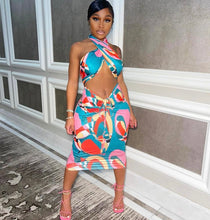 Load image into Gallery viewer, This sexy Picasso skirt set is everything and a definite must have for your wardrobe babe. Easy to style and has plenty stretch! This super cute skirt set comes in a mid length featuring a ruched detail, elastic waistband and matching cross wrap top. Pair with a statement high heels and handbag for a complete look. 
