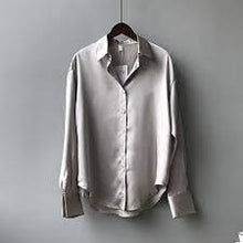 Load image into Gallery viewer, A timeless classic blouse made from the finest silk. Featuring a luxe gray satin fabric, a loose fit and button up front - this shirt can be styled up or down whatever the occasion. Team it with some high waist pants and strappy heels for a must have look.
