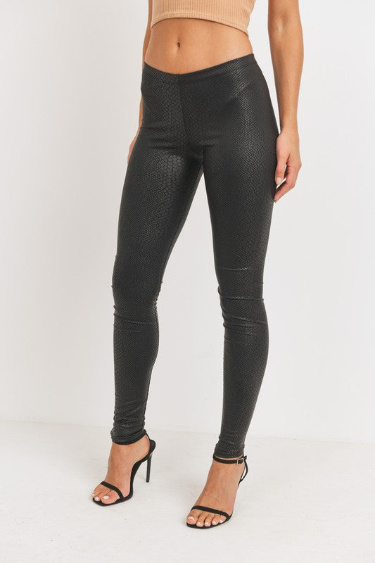 Every fashionista knows she must have a pair of faux snake skin leather leggings in her fall fashion wardrobe. Featuring a high fashion faux leather fabric and body sculpting fit. Make these pants this seasons go-to when dressing them up with your favorite pieces from home!