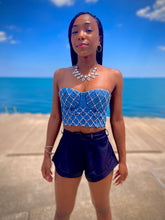 Load image into Gallery viewer, We&#39;re bringing the heat with these flowy swing it baby shorts! Great for day parties with your girls or even a night out with your bae! These shorts come in a soft black material, front zip and button closure. Style these sexy shorts with a white bodysuit or a rhinestone denim corset, simple high heels and handbag for a complete look!
