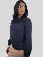 Load image into Gallery viewer, Girl we are lovin&#39; this blouse top, featuring a white soft material, with a tie up riffle collar. Team this with matching satin trousers and killer heels for that last minute night out outfit. 
