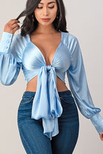 Load image into Gallery viewer, This top and color combination is everything! It has the perfect colors for a transition into this season. This crop top features a classic collar neckline, baby blue satin material, tie front, and plunge neckline. Whether you pair with jeans, leather pants or shorts; this top is definitely a hit! 
