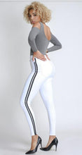 Load image into Gallery viewer, Flex your style in these cute white skinny Jeans with a contrast black stripe designs. Perfect for styling any and every way you want! These jeans come in a high rise fit featuring a raw uneven hem ends, zip and button closure. Pair with a graphic tee or chic fashion top, high heels or combat boots and of course a handbag for a complete look!
